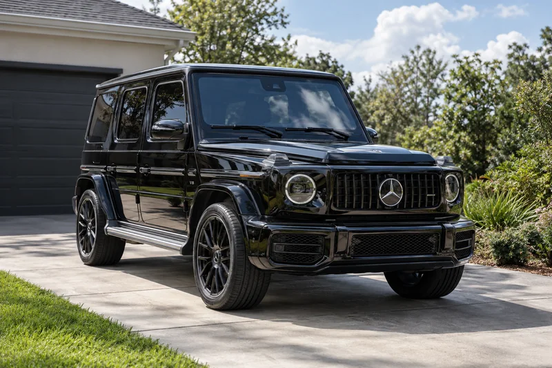 Car with dark tinted windows parked on a driveway