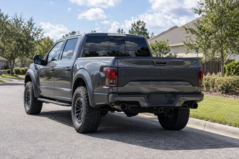 Car with dark tinted windows parked on a driveway