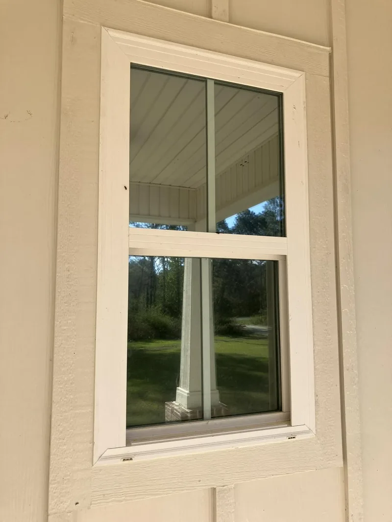 Home window with window film looking out to the porch — a job by RJ’s Tint Shop in Crestview, FL