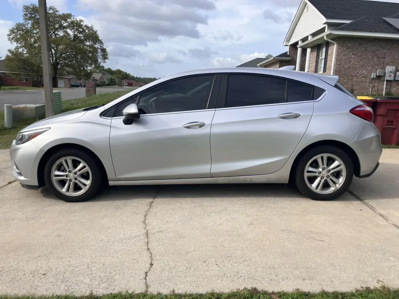 Silver Chevrolet Cruze with tinted side windows — a job by RJ’s Tint Shop in Crestview, FL