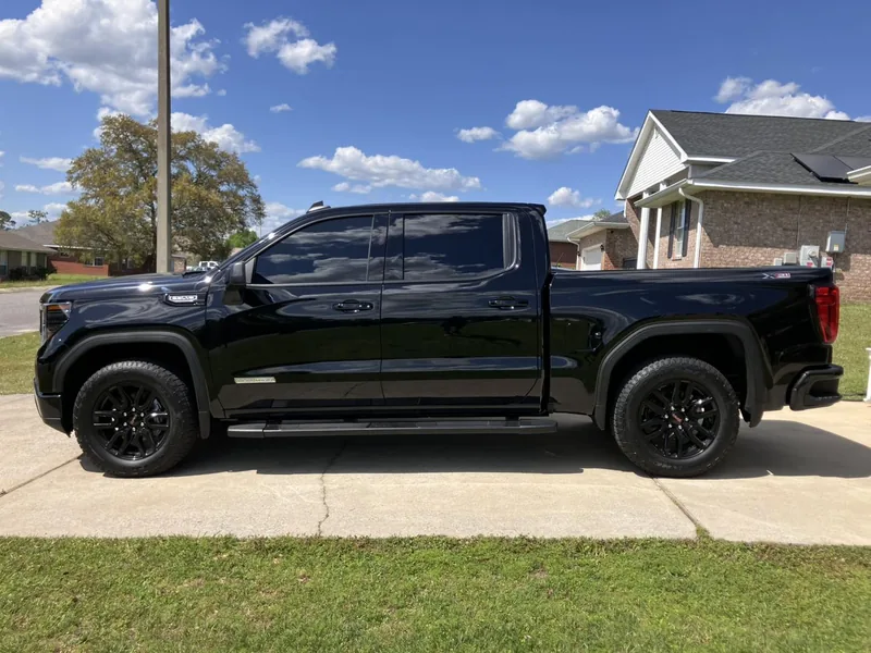 Black GMC Sierra with tinted side windows — a job by RJ’s Tint Shop in Crestview, FL