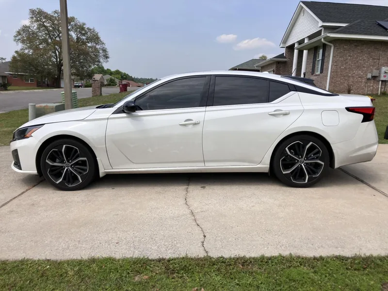 White Nissan Altima with tinted side windows — a job by RJ’s Tint Shop in Crestview, FL