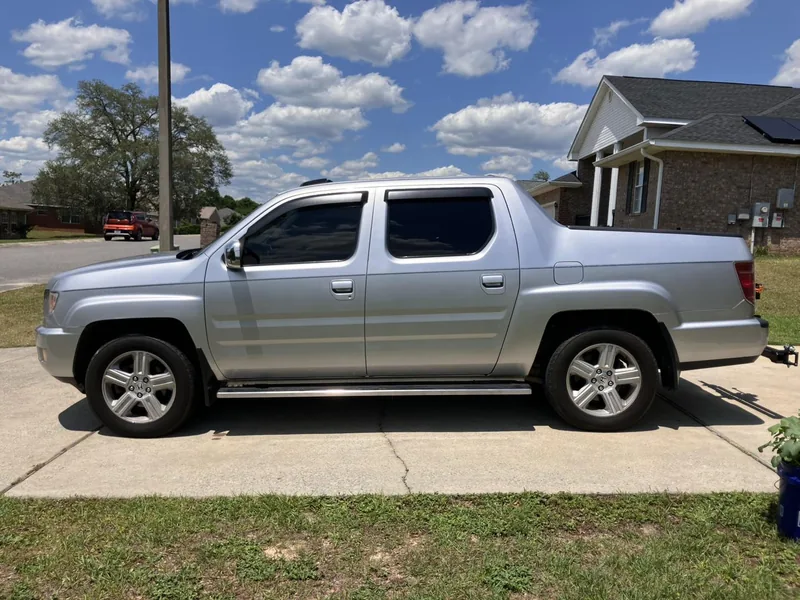 Silver Honda Ridgeline with tinted windows — a job by RJ’s Tint Shop in Crestview, FL