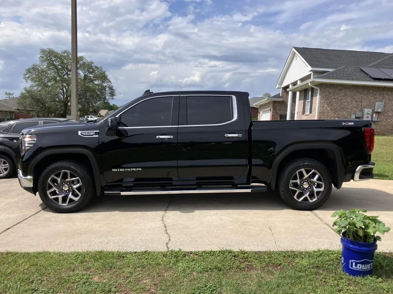 Black GMC Sierra pickup with tinted windows — a job by RJ’s Tint Shop in Crestview, FL